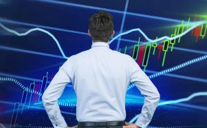 A man looks at financial charts. Art by Empanda.